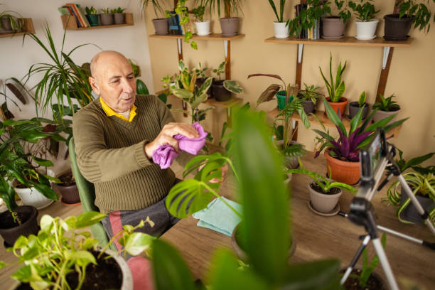 istock Senior Man Demonstrating Plant Care Tips 2185418791