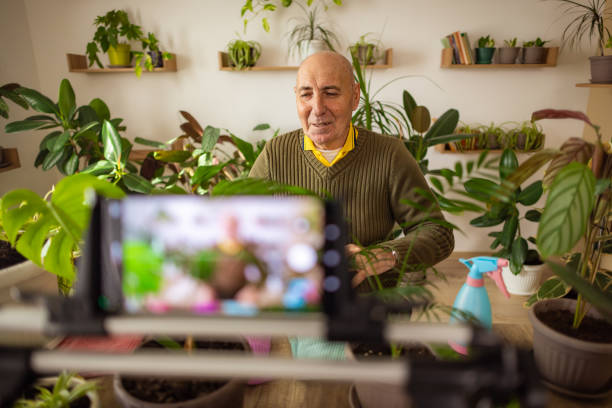 istock Retired Gentleman Sharing Plant Care Secrets 2185418842