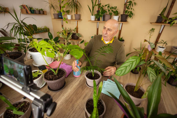 istock Older Man Vlogging About Indoor Plants 2185419114