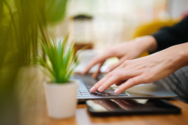 istock laptop keyboard typing cozy home office interior 2185419364