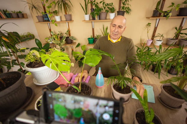 istock Retired Man Educating on Plant Care 2185419470