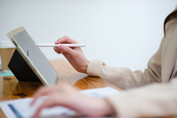 istock Close-up of a businesswoman using a tablet and stylus for work 2185420227