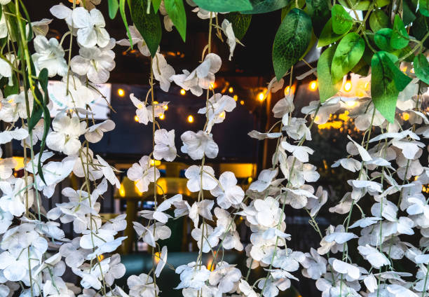 istock A curtain of artificial flowers over a patio opening. 2185422441