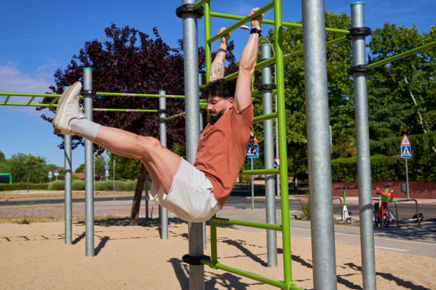 istock A Caucasian man performs hanging leg raises on a bar, 2185422652