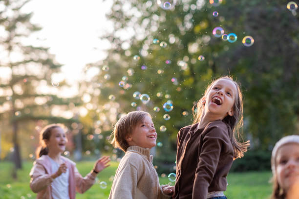 istock children play with soap bubbles 2185423166