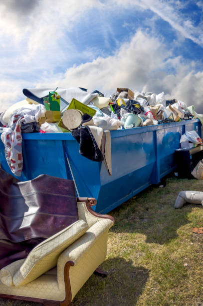 istock Dumpster full of garbages at garbage dump area 2185423713