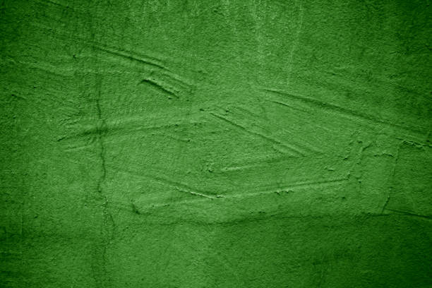 Grunge scratched green cement wall texture background