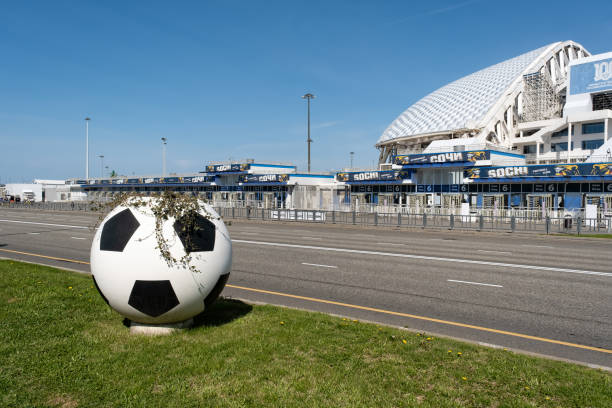 Large soccer ball sculpture with greenery outside a modern stadium on a clear day in Sochi, Russia April 16, 2023.