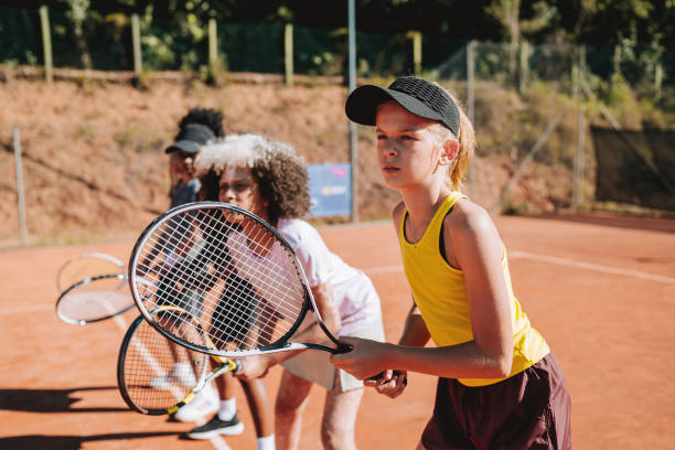 istock Children learning to play tennis 2185425900