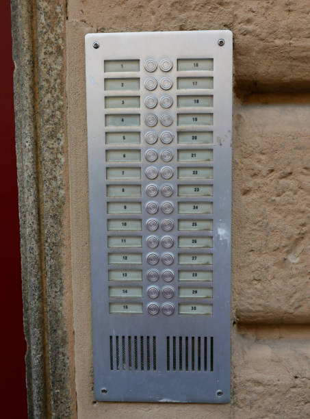 apartment building intercom system with 30 buttons to call apartments numbered without names