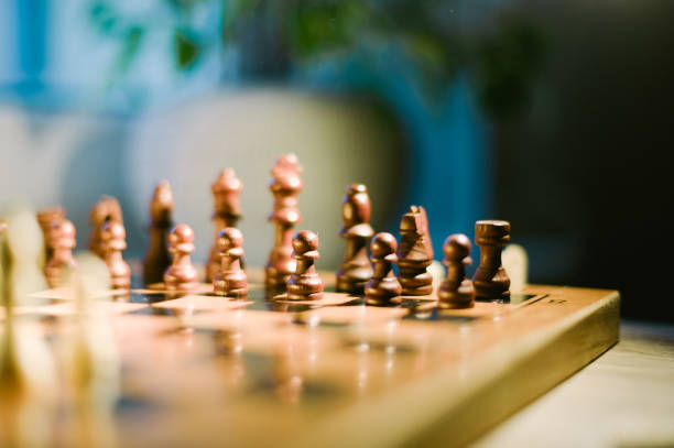 istock A wooden chess board with pieces on it 2185426924