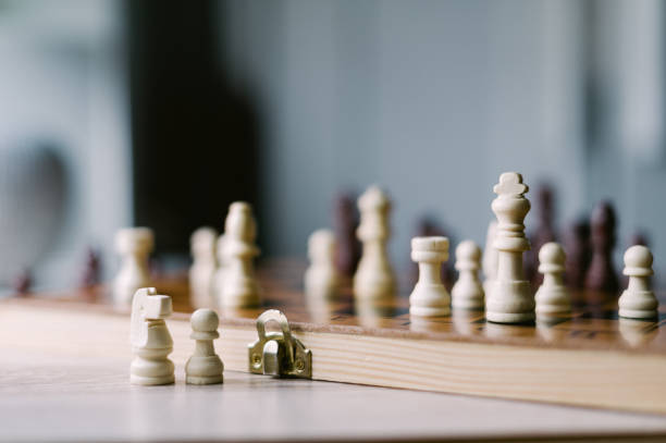 istock A wooden chess board with a few pieces on it 2185427298