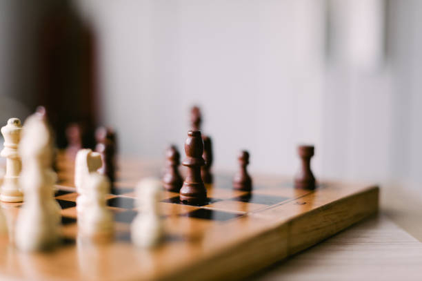 istock A wooden chess board with a few pieces on it 2185427322