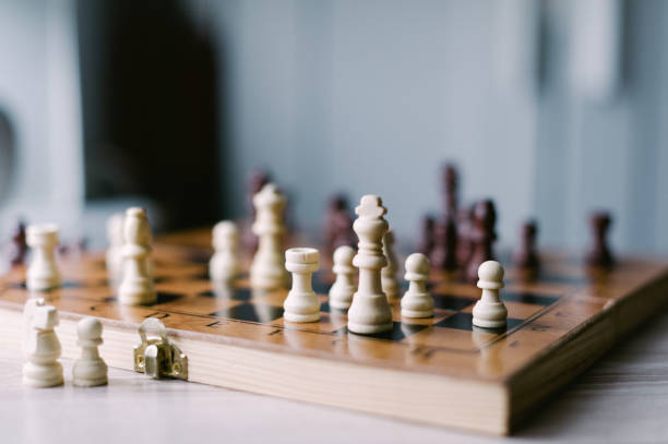 istock A wooden chess board with a few pieces on it 2185427375