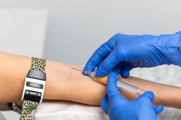 istock Nurse taking a blood sample from a patients arm 2185427873