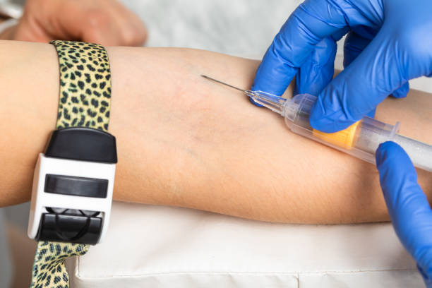 istock Nurse taking a blood sample from a patients arm 2185427899