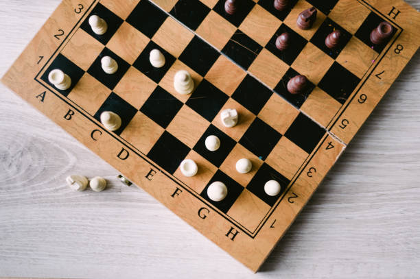 istock A wooden chess board with a few pieces on it 2185429303