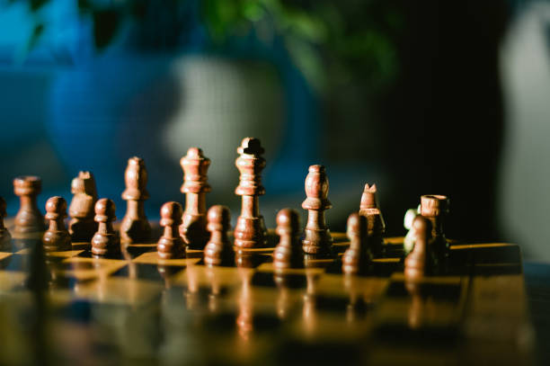 istock A wooden chess board with pieces on it 2185429864