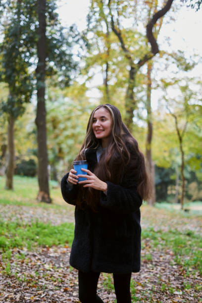 istock young woman in the forest 2185430372