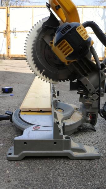 istock miter saw standing on asphalt in the yard 2185430462