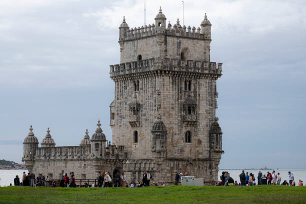 Visitors walk outside the Belém Tower, a 16th-century fortification located in Lisbon that served as a point of embarkation and disembarkation for Portuguese explorers and as a ceremonial gateway to Lisbon. (October 2024)