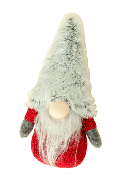 istock A fuzzy, gray gnome wearing a red sweater stands on a white background 2185431570