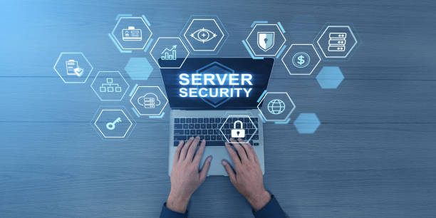 istock Hands on laptop with Server Security text and tech icons on wooden background. 2185431656