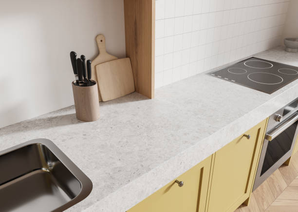 istock Modern kitchen countertop with sink, stove, and utensils on a bright background. 3D Rendering 2185431820