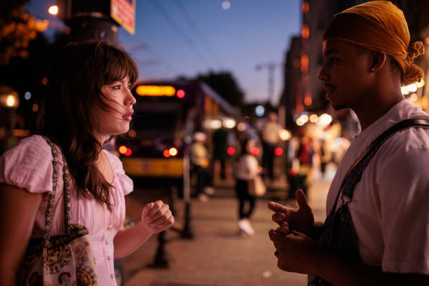 istock Young couple talking on the street 2185432267