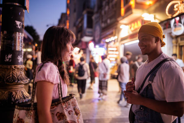 istock Young couple talking on the street 2185432276
