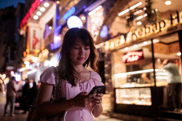 istock Young woman tourist using phone 2185432288