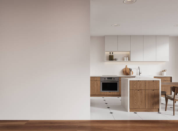 istock Cozy home kitchen interior with bar island, cooking cabinet and mockup wall 2185432295