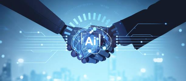 istock Human and robot handshake symbolizing AI collaboration on a digital background. 2185432385