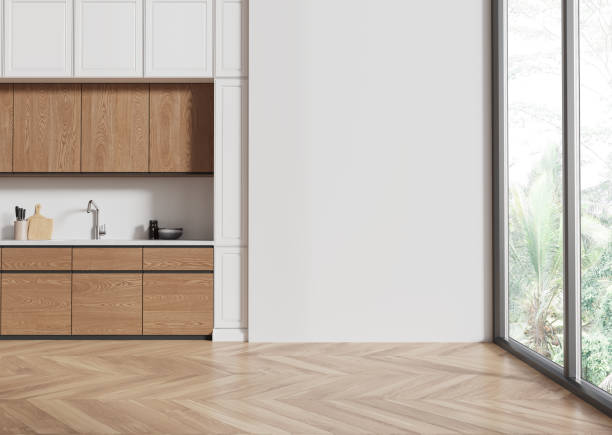 istock Stylish home kitchen interior with cooking cabinet and window, mockup wall 2185433189