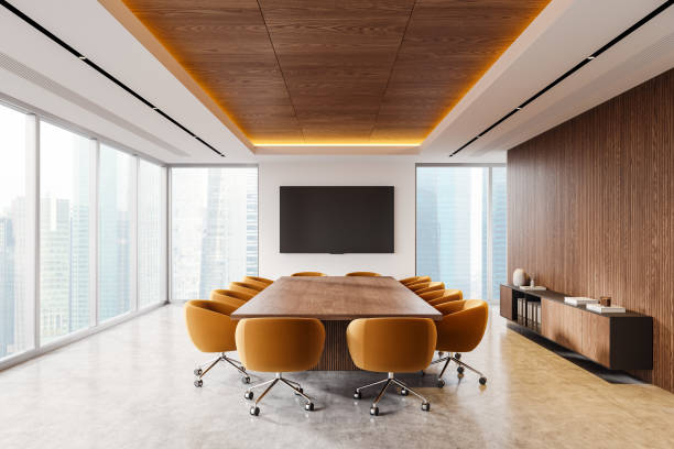 istock Modern conference room with orange chairs and wooden table. 3D Rendering 2185433389