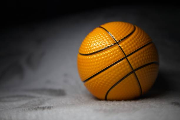 istock Miniature Basketball in Spotlight 2185433875