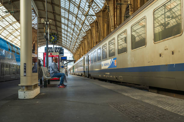 Nice, France - October 22, 2024: Passengers are waiting for the train at the railway station Nice - Ville