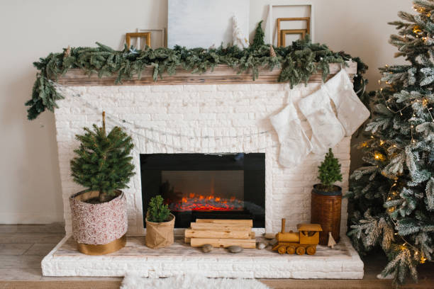 istock Fireplace with a Christmas tree and stockings at living room 2185444284