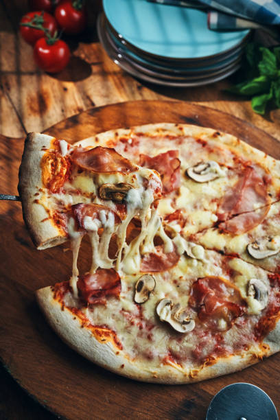 istock Pizza with Prosciutto Cotto Ham and Mushrooms 2185445441