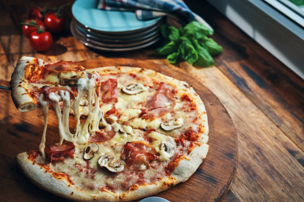 istock Pizza with Prosciutto Cotto Ham and Mushrooms 2185445545
