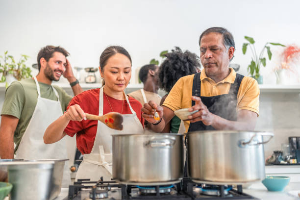 istock Joyful Indian Cooking Workshop with Chef and Participants 2185448112