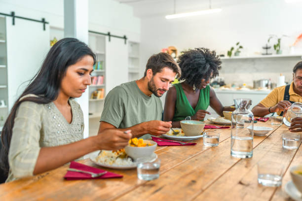 istock Enthusiastic Cooks Savor Indian Cuisine in Culinary Workshop 2185448280