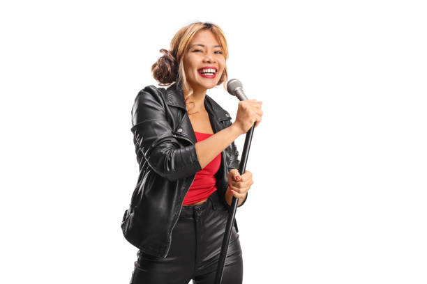 istock Smiling female singer with a microphone 2185449252