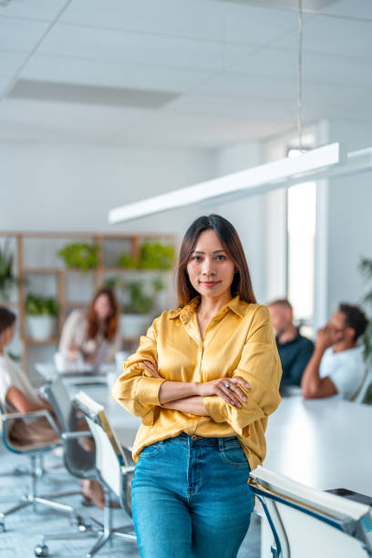 istock Confident Asian Businesswoman in Modern Office 2185449553