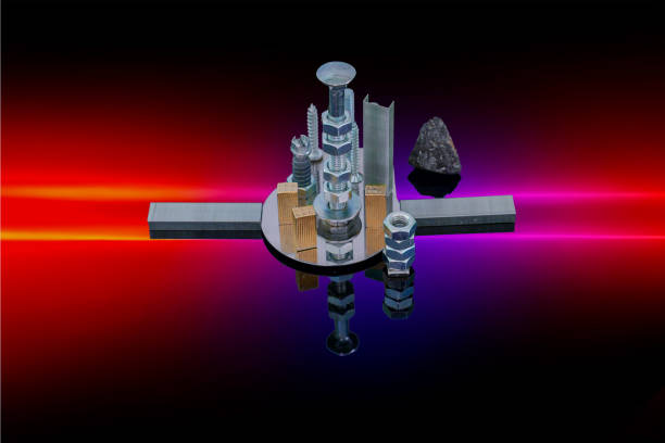 istock Modern city built with hardware screws, bolts, and nuts on reflective surface 2185449749