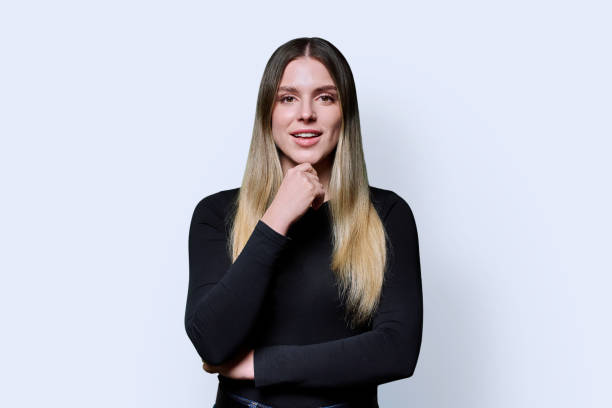 istock Portrait young smiling woman on white studio background 2185451136