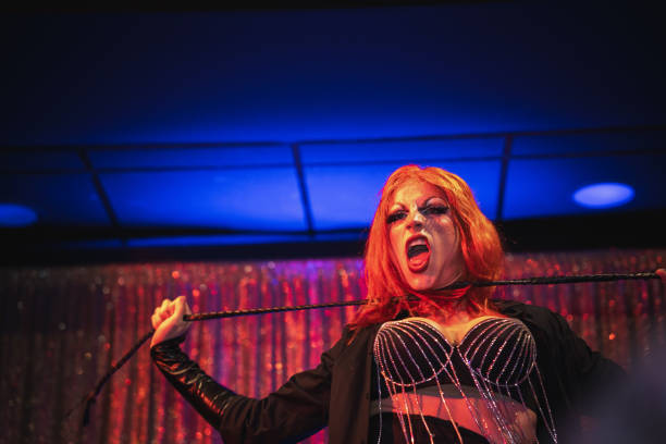 istock Drag queen performing with whip on stage in nightclub 2185451553