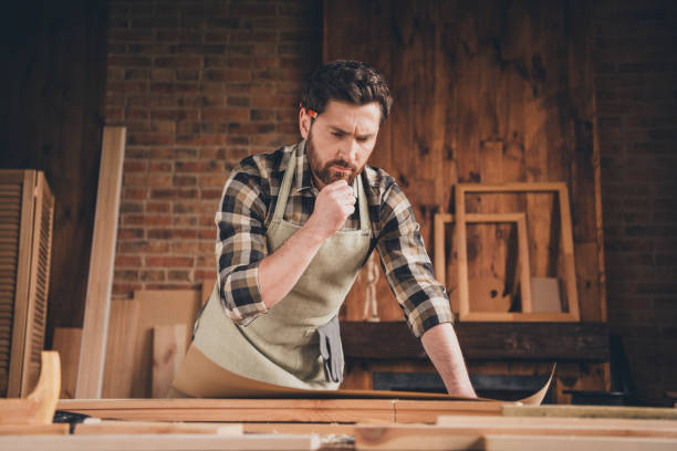 istock Photo of expert builder craftsman guy look plan scheme in garage indoors 2185452040