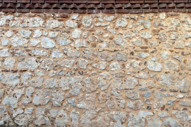 Old rough stone wall. Close up background photo texture