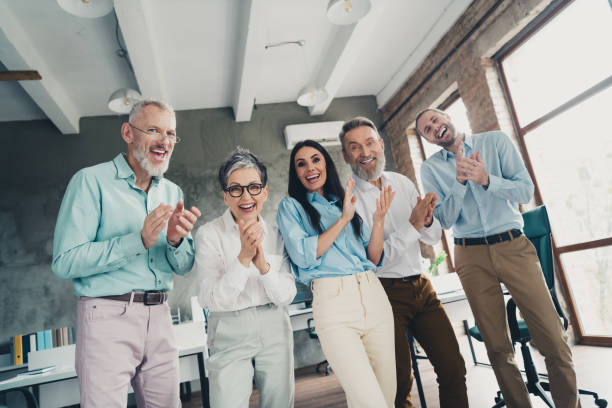 istock Photo of teamwork startup partners clapping hands applause congratulation comfortable nice creative startup office loft room interior 2185455572